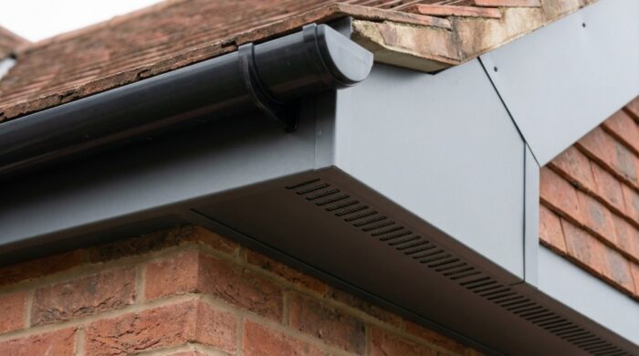 What Is a Soffit? Everything UK Homeowners and Builders Need to Know 6 Close-up of a vented aluminium soffit panel with ventilation slots and insect mesh installed
under roof eaves on a UK residential property.