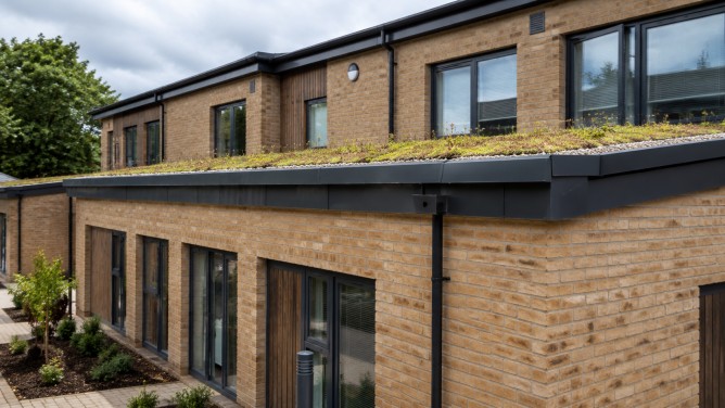 Roof Accessories: A Practical Guide for UK Roof Projects 6 Roof accessories on a UK pitched roof showing a neat valley flashing detail, tiled roof surface and black guttering