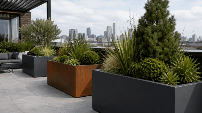 Why Large Metal Planters Need Careful Outdoor Planning 6 large metal planters outdoor modern courtyard landscaping