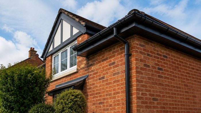 Metal Rain Gutters: Benefits, Types and Choosing the Right System 6 Metal rain gutters installation showing a professional aluminium gutter system solution