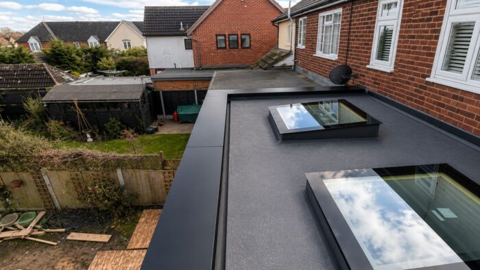 Parapet Wall Copings: What UK Projects Need to Get Right 4 Parapet wall copings protecting the top of a brick parapet wall.