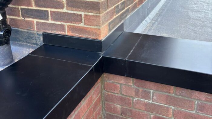 Parapet Wall Copings: What UK Projects Need to Get Right 5 Parapet wall copings in a grey aluminium finish on a contemporary UK property.