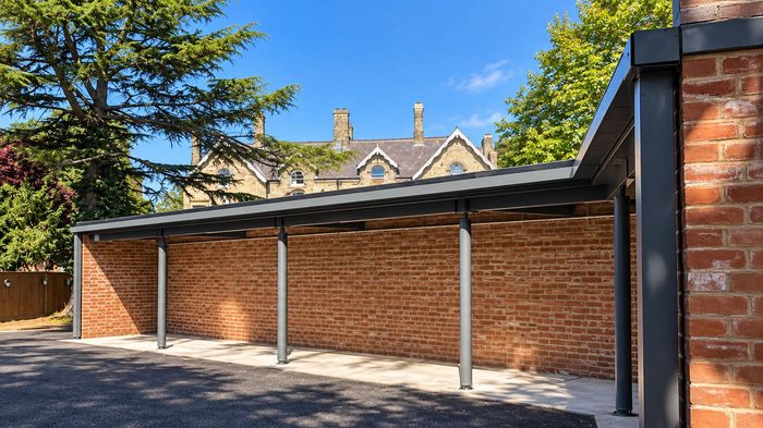How to Choose the Best Box Gutter Material for UK Buildings 4 Box Gutter Material installed along the roof edge of a modern timber-clad school extension