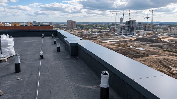Coping Superstore for Aluminium Copings and Bespoke Projects 5 Coping superstore aluminium coping installed around a large commercial flat roof on a UK construction project.