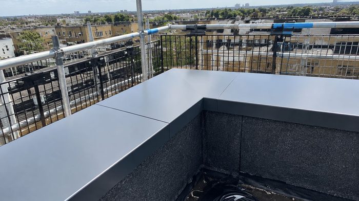 Coping Superstore for Aluminium Copings and Bespoke Projects 4 Coping superstore flat aluminium coping with a precision corner detail installed on a UK rooftop parapet.
