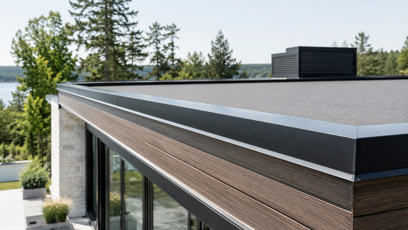 Flat roof drip edge trim installed on a modern UK home extension with a clean dark grey roofline.