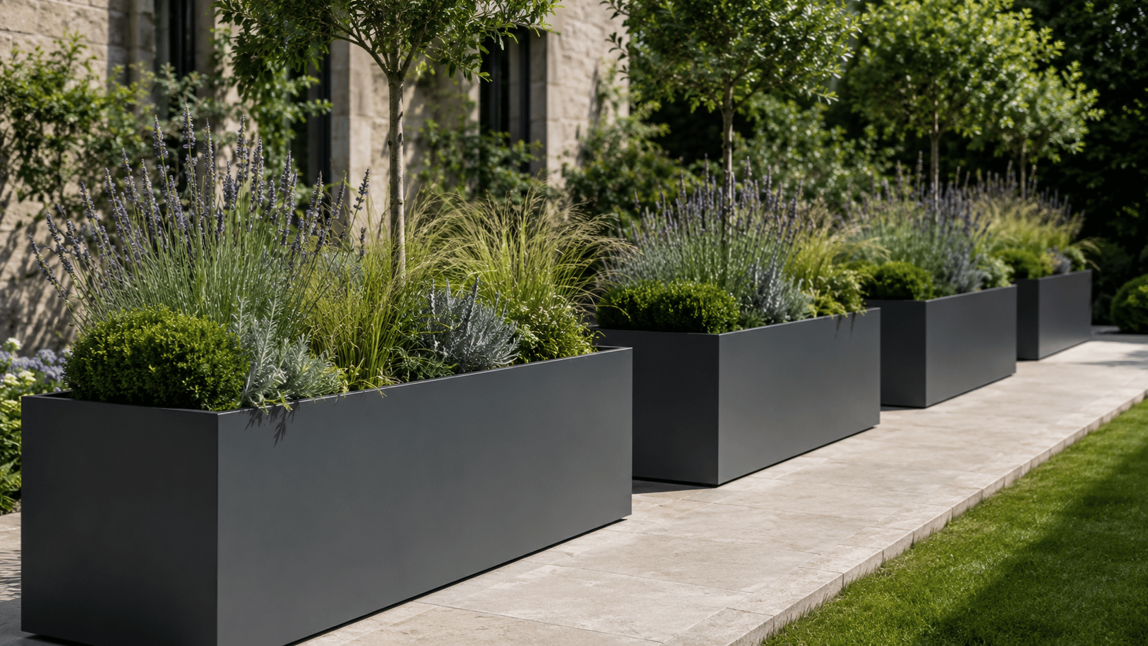 Large metal planters outdoor arranged in a modern garden patio with sleek contemporary landscaping.
