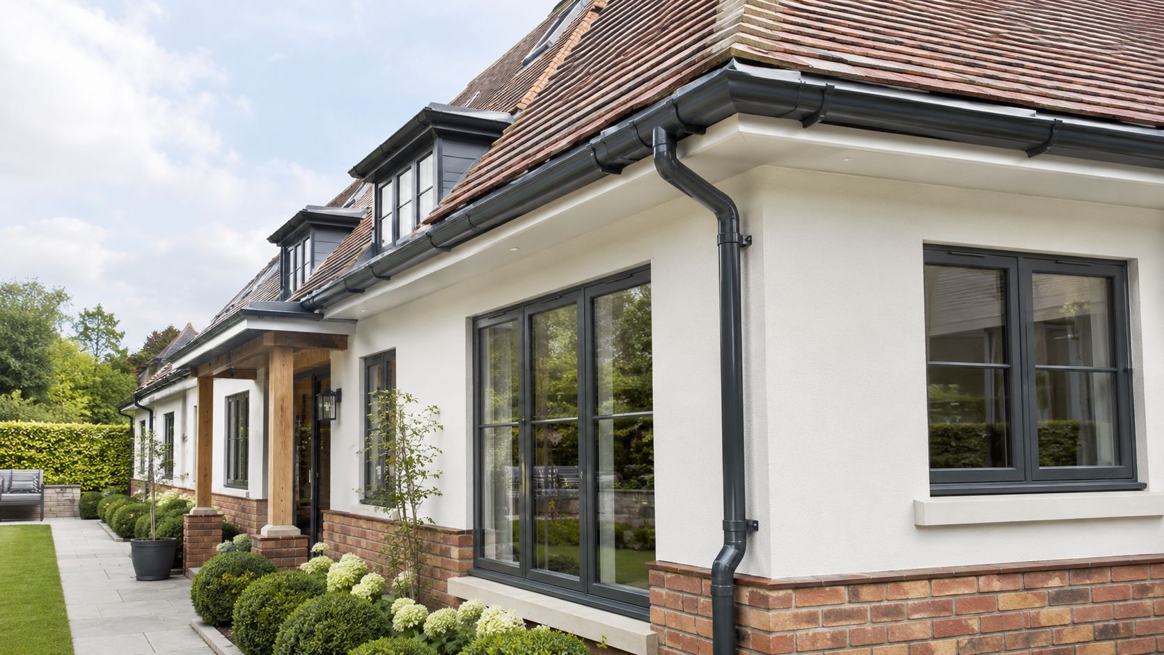How much does new guttering cost for a typical UK home with replacement gutters and downpipes