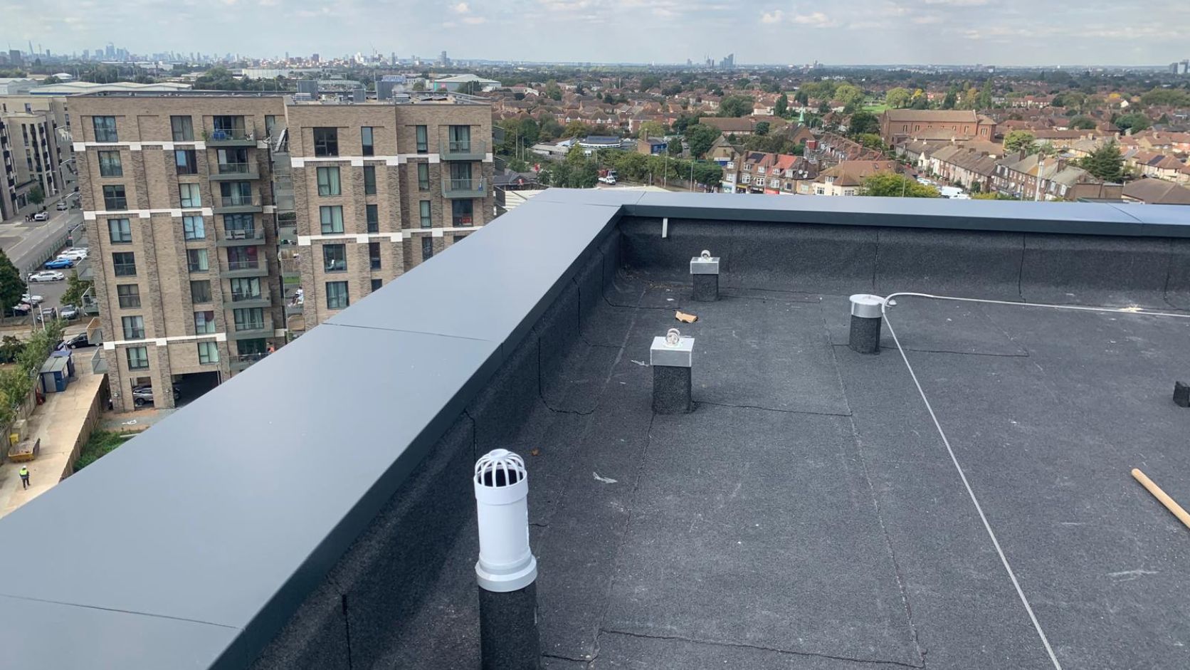 Aluminium copings with powder coated finish, concealed fixing design and weather resistant features for professional parapet wall protection systems.